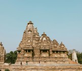 Exterior of ancient temple on blue sky, Khajuraho