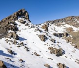People Climbing on Mountain Peak