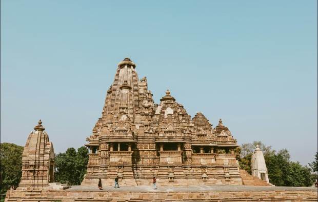 Exterior of ancient temple on blue sky, Khajuraho