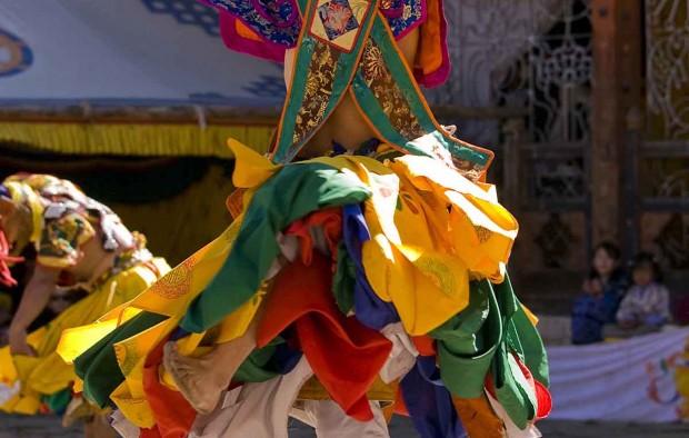 Masked man dancing on a Tsechus - Lumle holidays