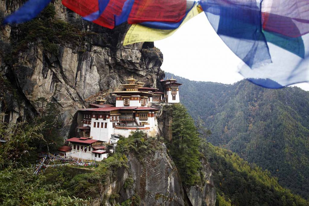 Prayer flags above the sacred Tatkshang Lhakang, Bhutan.