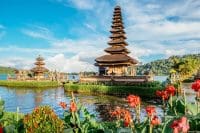 Pura Ulun Danu Bratan, Hindu temple surrounded by flowers on Bratan lake is a major Shivaite and water temple in Bali, Indonesia